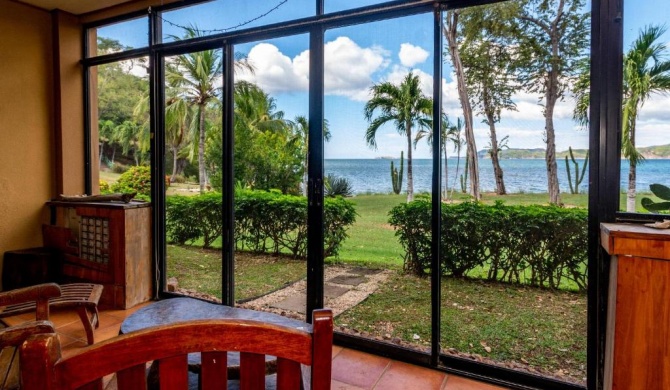 Warm Interiors and Orange Hues on Ground Floor in Front of Beach